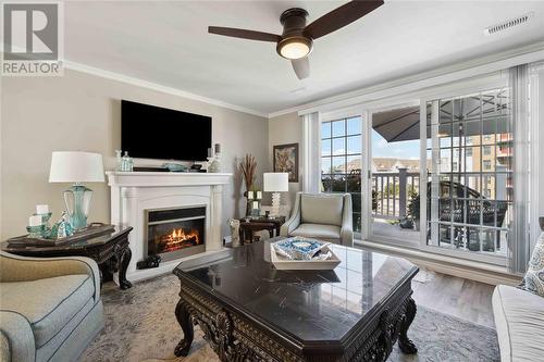 1510 Venetian Boulevard Unit# M7, Point Edward, ON - Indoor Photo Showing Living Room With Fireplace