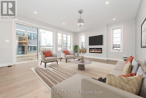 49 Periwinkle Road, Springwater (Midhurst), ON - Indoor Photo Showing Living Room With Fireplace