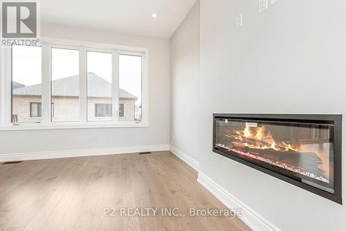 4 Wild Ginger Lane, Springwater (Midhurst), ON - Indoor With Fireplace