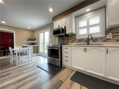 Kitchen - view from entry hall - 407 Melanie Crescent, Ancaster, ON - Indoor Photo Showing Kitchen With Double Sink