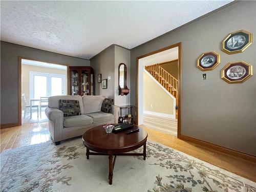 Main living room - view of stairs and kitchen - 407 Melanie Crescent, Ancaster, ON - Indoor Photo Showing Living Room