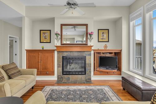 675 Westpoint Court, Kelowna, BC - Indoor Photo Showing Living Room With Fireplace