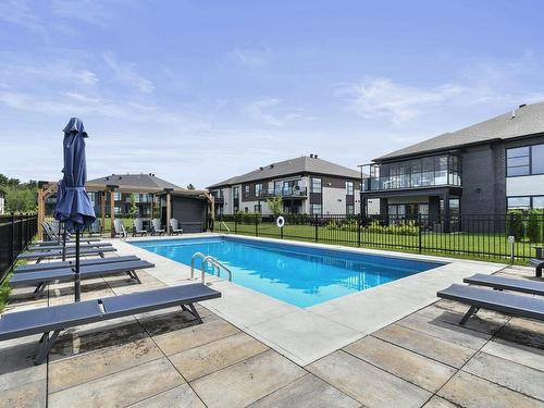 Piscine - 5-319 Rue De L'Aigle, Carignan, QC - Outdoor With In Ground Pool With Backyard