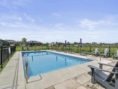 Piscine - 5-319 Rue De L'Aigle, Carignan, QC - Outdoor With In Ground Pool With Backyard