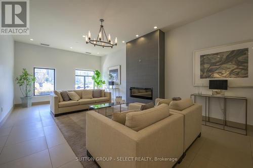 1110 - 240 Villagewalk Boulevard, London, ON - Indoor Photo Showing Living Room With Fireplace