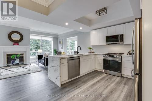 309 - 250 Sydenham Street, London, ON - Indoor Photo Showing Kitchen With Fireplace With Upgraded Kitchen