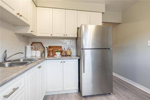 27 Woodman Drive N, Hamilton, ON - Indoor Photo Showing Kitchen With Double Sink