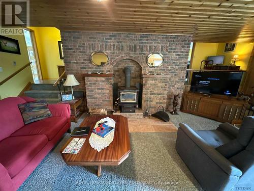 466 Grenfell Road, Timiskaming Remote Area, ON - Indoor Photo Showing Living Room With Fireplace