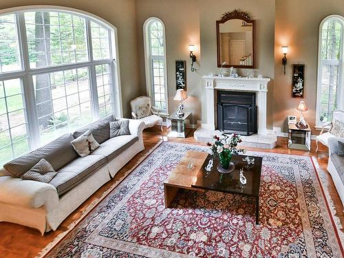 Overall view - 125 Rue Du Bonniebrook, Saint-Colomban, QC - Indoor Photo Showing Living Room With Fireplace