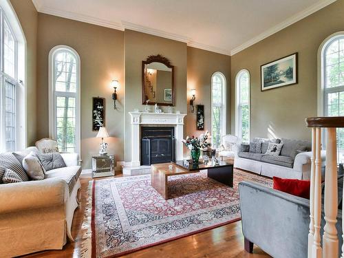 Living room - 125 Rue Du Bonniebrook, Saint-Colomban, QC - Indoor Photo Showing Living Room With Fireplace