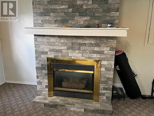 5216 42 Street Ne, Chetwynd, BC - Indoor Photo Showing Living Room With Fireplace