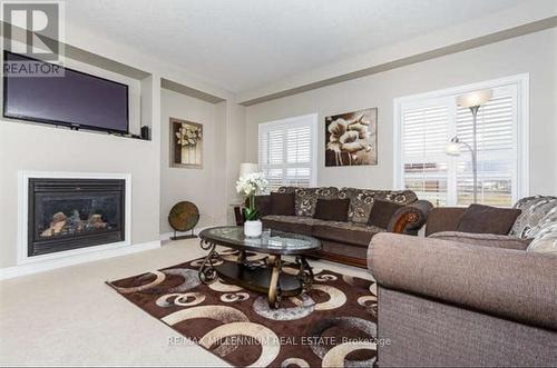 12 Burt Avenue, New Tecumseth (Alliston), ON - Indoor Photo Showing Living Room With Fireplace