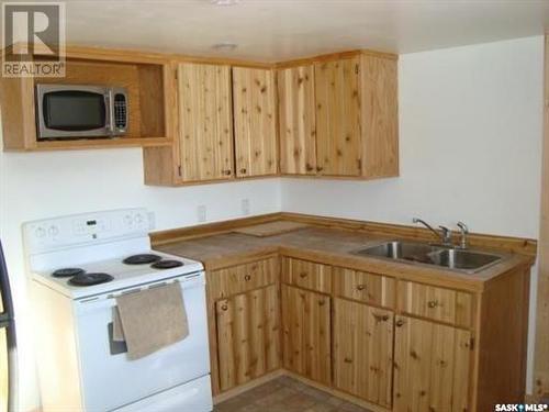 48 Main Street, Manor, SK - Indoor Photo Showing Kitchen With Double Sink