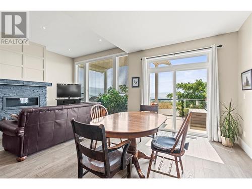 6536 Blackcomb Place, Vernon, BC - Indoor Photo Showing Dining Room With Fireplace