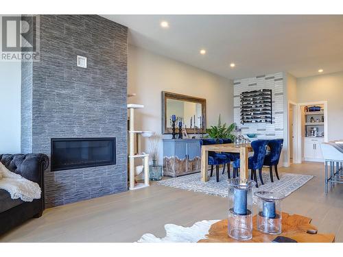 7716 Okanagan Hills Boulevard Unit# 2, Vernon, BC - Indoor Photo Showing Living Room With Fireplace