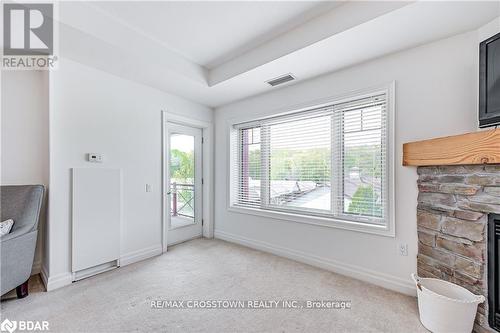 308 - 130 Steamship Bay Road, Gravenhurst, ON - Indoor Photo Showing Other Room With Fireplace