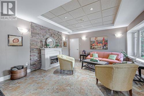 308 - 130 Steamship Bay Road, Gravenhurst, ON - Indoor Photo Showing Living Room With Fireplace