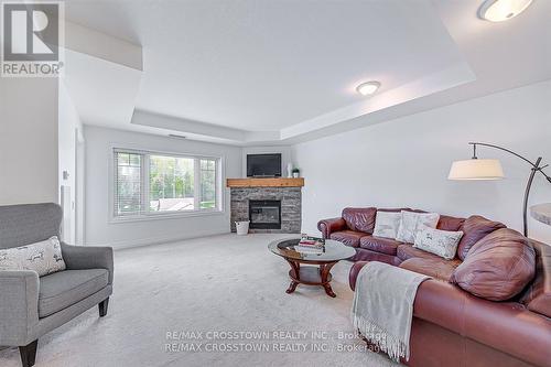 308 - 130 Steamship Bay Road, Gravenhurst, ON - Indoor Photo Showing Living Room With Fireplace