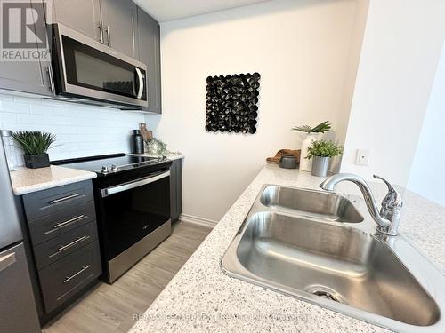 304 - 460 Dundas Street E, Hamilton (Waterdown), ON - Indoor Photo Showing Kitchen With Double Sink