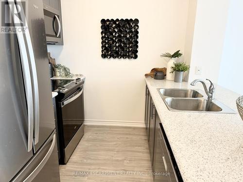 304 - 460 Dundas Street E, Hamilton (Waterdown), ON - Indoor Photo Showing Kitchen With Double Sink