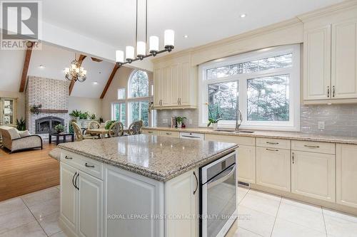 3-1058 Whites Road, Muskoka Lakes, ON - Indoor Photo Showing Kitchen With Fireplace