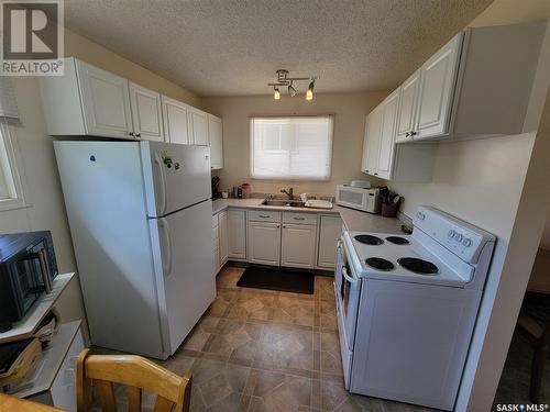 343 La Ronge Road, Saskatoon, SK - Indoor Photo Showing Kitchen With Double Sink