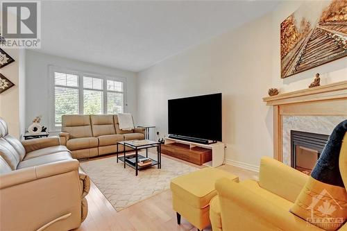 204 Espin Heights, Ottawa, ON - Indoor Photo Showing Living Room With Fireplace