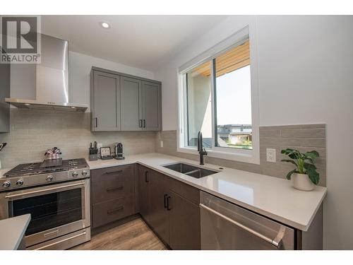 105 Predator Ridge Drive Unit# 4, Vernon, BC - Indoor Photo Showing Kitchen With Double Sink With Upgraded Kitchen