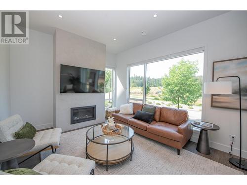 105 Predator Ridge Drive Unit# 4, Vernon, BC - Indoor Photo Showing Living Room With Fireplace