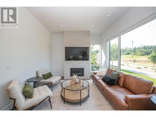 105 Predator Ridge Drive Unit# 4, Vernon, BC - Indoor Photo Showing Living Room With Fireplace