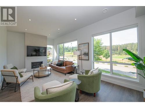 105 Predator Ridge Drive Unit# 4, Vernon, BC - Indoor Photo Showing Living Room With Fireplace