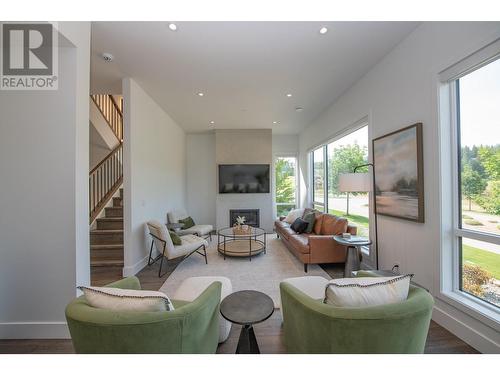 105 Predator Ridge Drive Unit# 4, Vernon, BC - Indoor Photo Showing Living Room With Fireplace