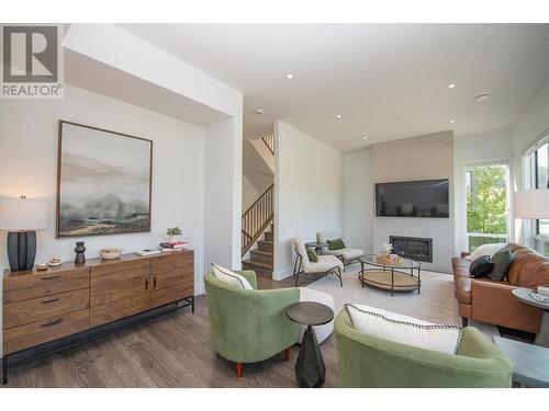 105 Predator Ridge Drive Unit# 4, Vernon, BC - Indoor Photo Showing Living Room With Fireplace