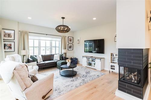 306 Duchek Drive, Ritchot Rm, MB - Indoor Photo Showing Living Room With Fireplace