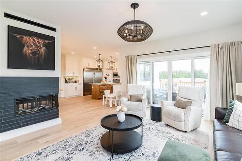 306 Duchek Drive, Ritchot Rm, MB - Indoor Photo Showing Living Room With Fireplace