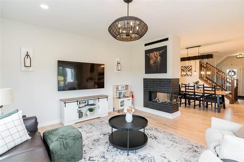 306 Duchek Drive, Ritchot Rm, MB - Indoor Photo Showing Living Room With Fireplace