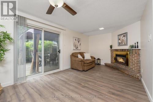 50 - 341 Wilson Drive, Milton (Dorset Park), ON - Indoor Photo Showing Living Room With Fireplace