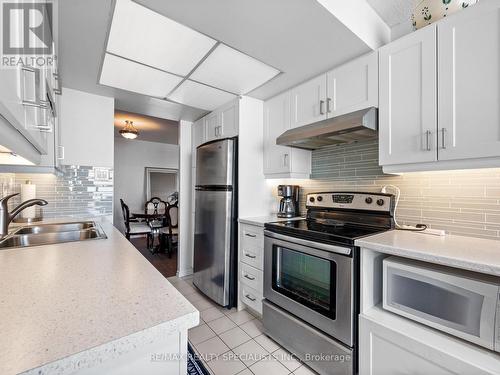 1408 - 20 Cherrytree Drive, Brampton, ON - Indoor Photo Showing Kitchen With Double Sink