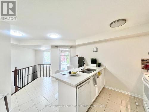 2 - 3395 Thomas Street S, Mississauga (Churchill Meadows), ON - Indoor Photo Showing Kitchen With Double Sink