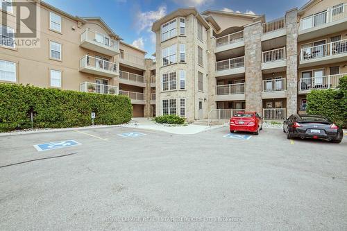 210 - 1460 Bishops Gate, Oakville (Glen Abbey), ON - Outdoor With Balcony With Facade