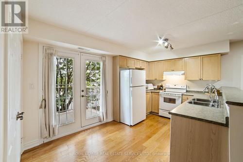 210 - 1460 Bishops Gate, Oakville (Glen Abbey), ON - Indoor Photo Showing Kitchen With Double Sink