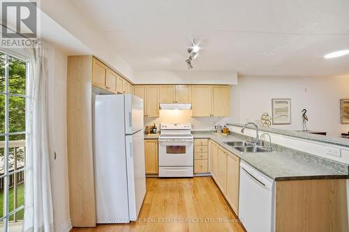 210 - 1460 Bishops Gate, Oakville (Glen Abbey), ON - Indoor Photo Showing Kitchen With Double Sink