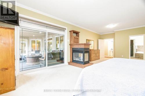 138 Knox Road E, Wasaga Beach, ON - Indoor Photo Showing Bedroom With Fireplace