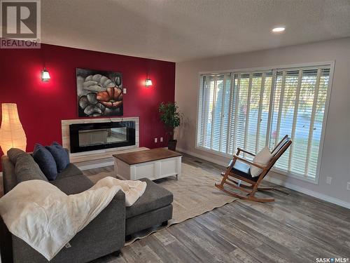 230 Ash Street, Outlook, SK - Indoor Photo Showing Living Room With Fireplace