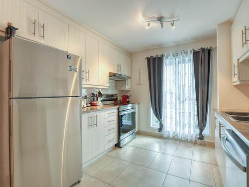 Kitchen - 175  - 181 Boul. Dagenais E., Laval (Vimont), QC - Indoor Photo Showing Kitchen With Double Sink