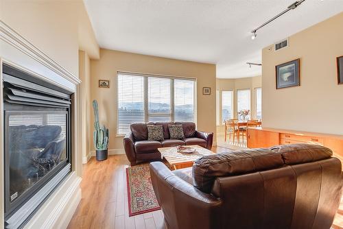 704-1947 Underhill Street, Kelowna, BC - Indoor Photo Showing Living Room With Fireplace