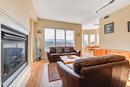 704-1947 Underhill Street, Kelowna, BC  - Indoor Photo Showing Living Room With Fireplace 