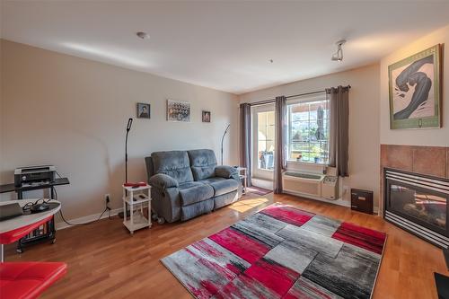 404-7600 Cottonwood Drive, Osoyoos, BC - Indoor Photo Showing Living Room With Fireplace