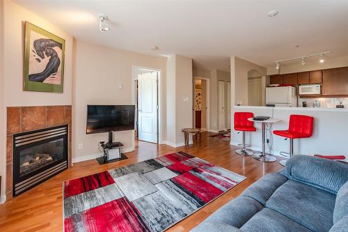 404-7600 Cottonwood Drive, Osoyoos, BC - Indoor Photo Showing Living Room With Fireplace