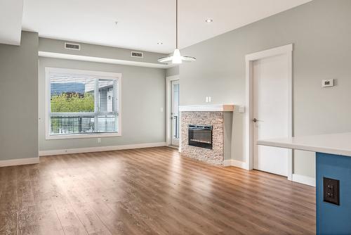 405-1883 Water Street, Kelowna, BC - Indoor Photo Showing Living Room With Fireplace